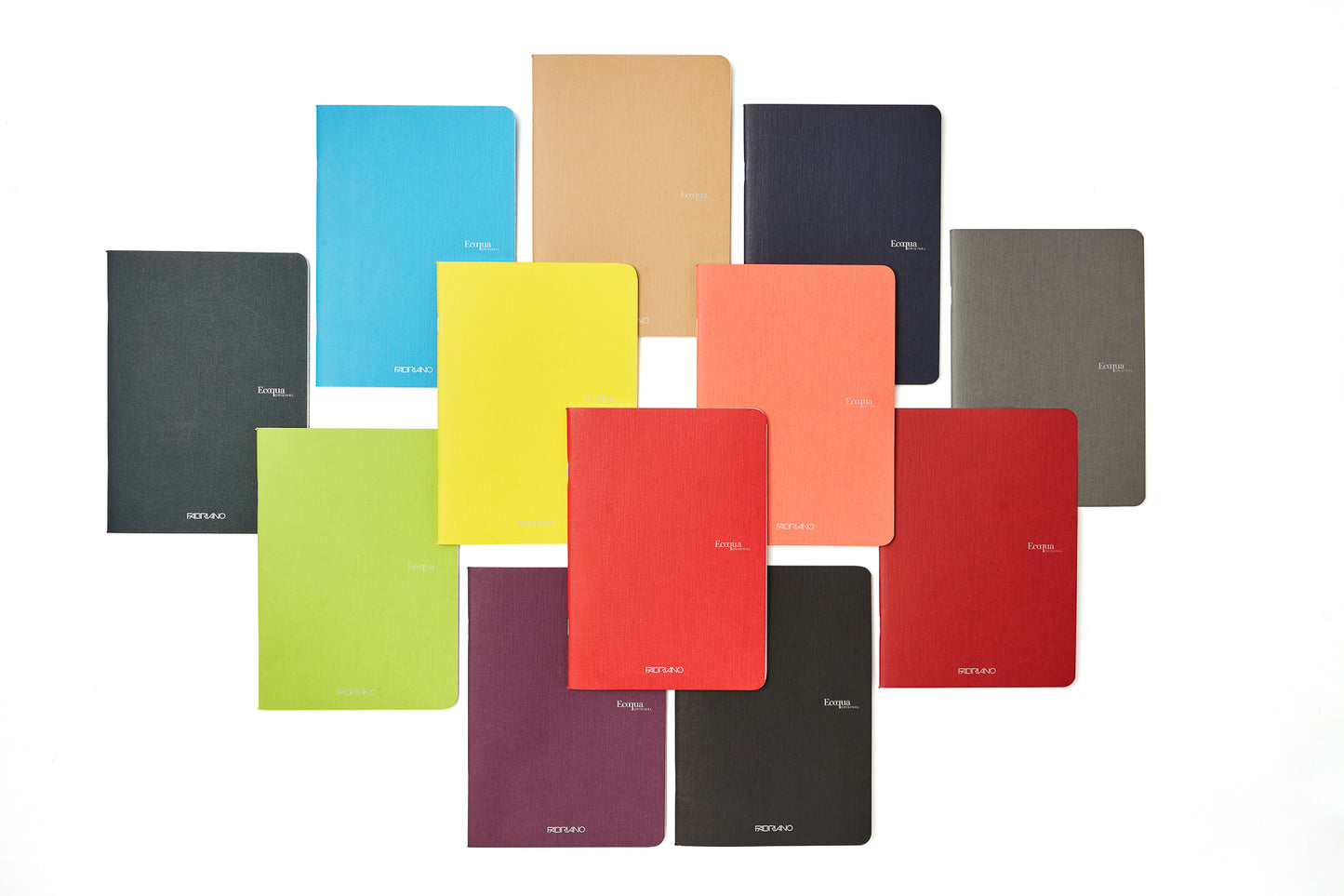 A collection of Fabriano Ecoqua Original stapled notebooks in various solid colors, displayed open to show the light ivory paper inside.