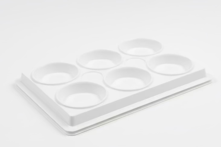 White plastic paint palette with six circular cavities