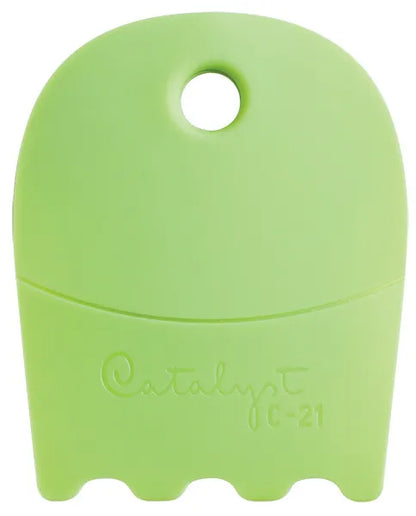 Green silicone tool with 'Catalyst' branding on a white background