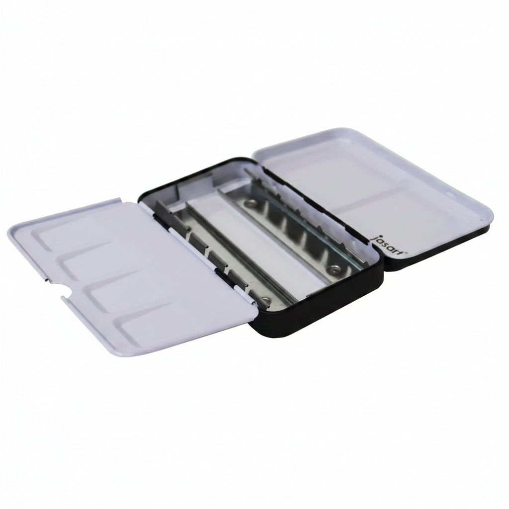 An open black and white paint tin palette case with multiple compartments, shown on a plain white background.
