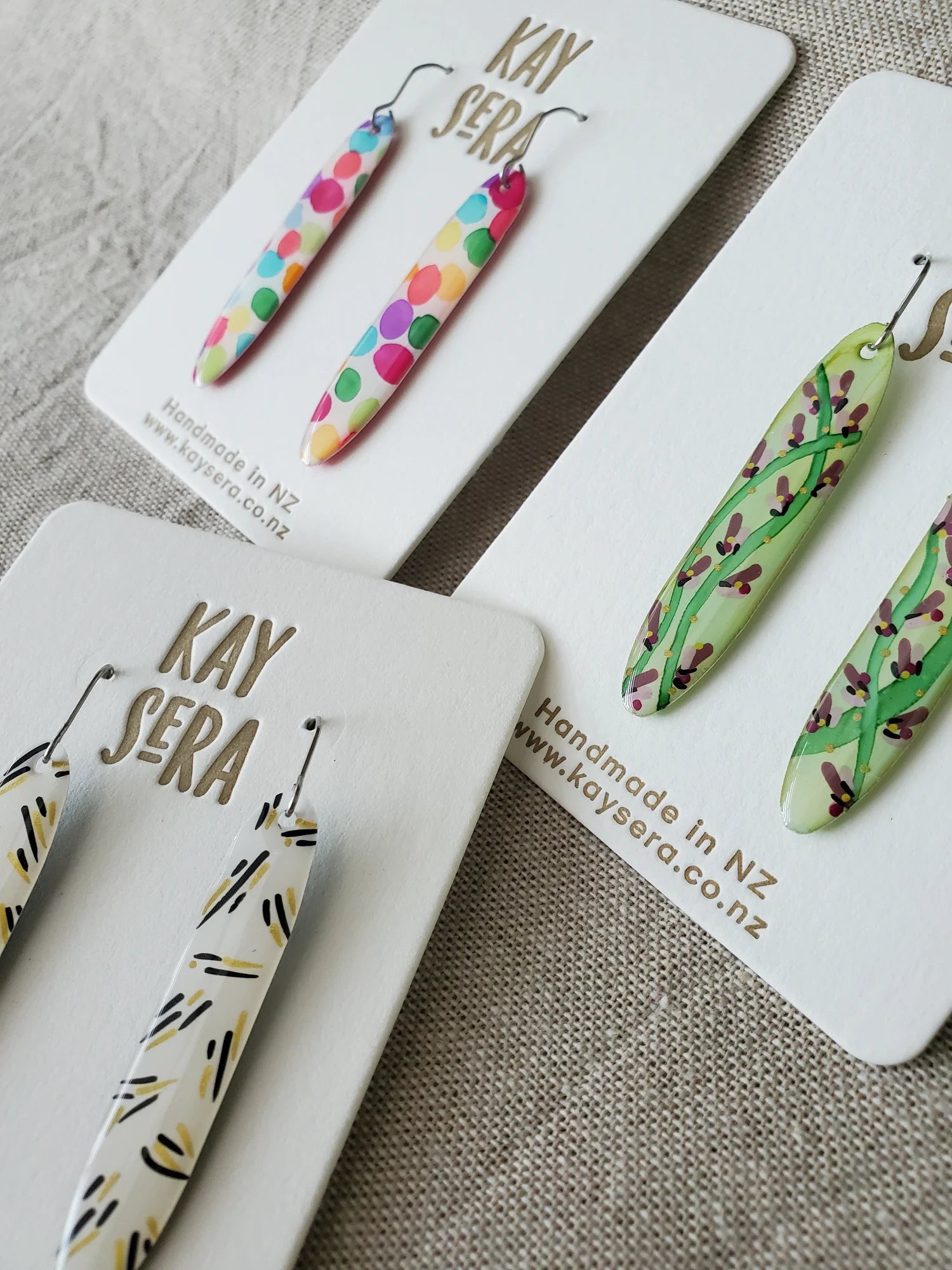 Hand-painted paper earrings vibrant floral design Palmerston North Kay Sera