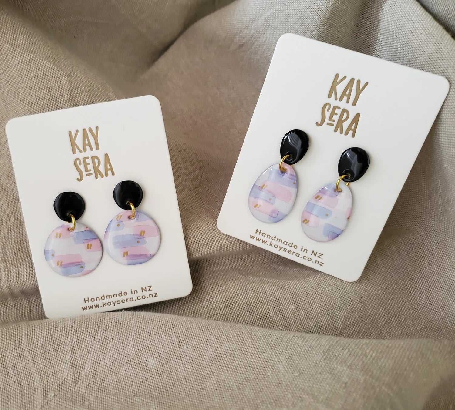 Hand-painted paper ear
rings vibrant floral design Palmerston North Kay Sera