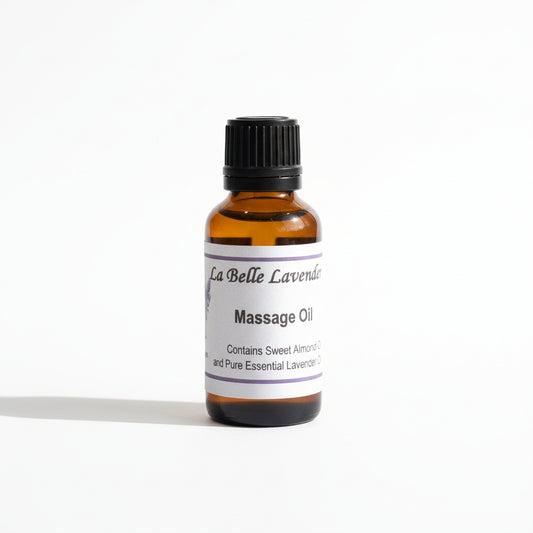 Bottle of La Belle Lavande massage oil on a blurred background