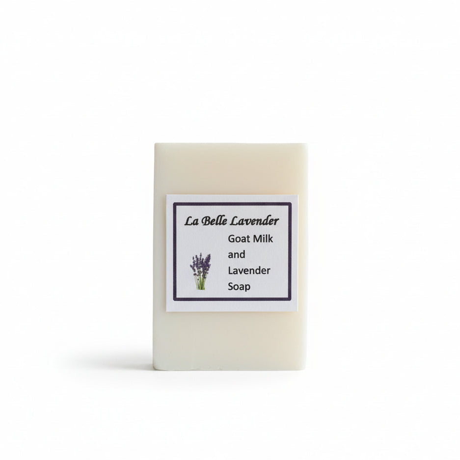Bar of lavender goats milk soap with a label on a white background