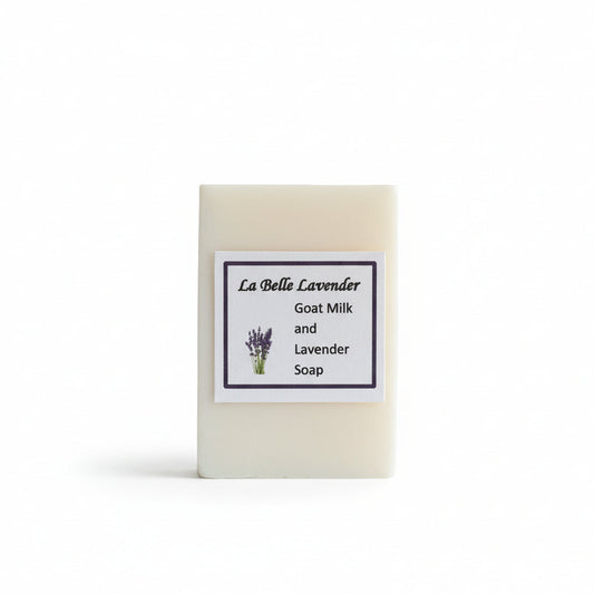 Bar of lavender goats milk soap with a label on a white background