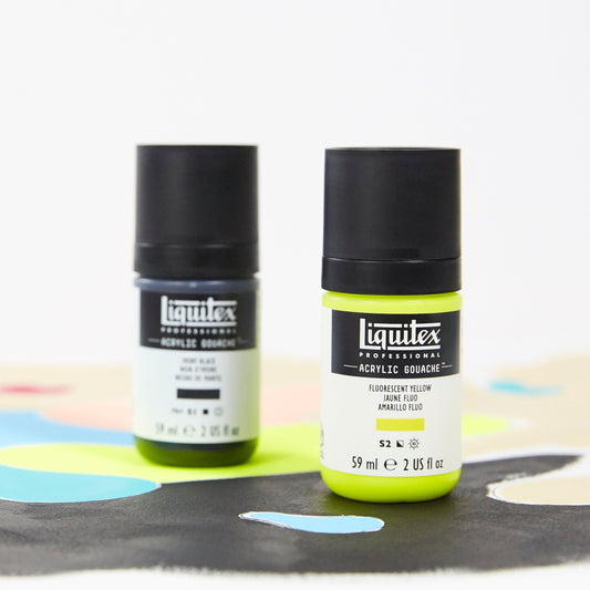 Two bottles of Liquitex spray paint on a white background with colorful paint splashes.