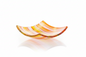 Decorative glass bowl with wavy design on a white background by glass artists David Traub