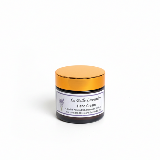 Hand cream jar with gold lid on a white background