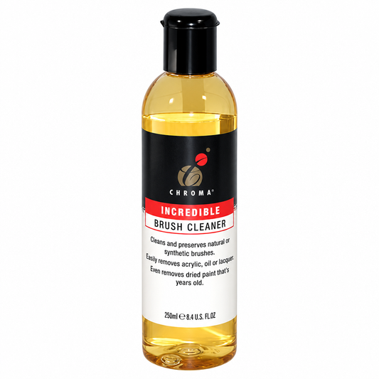 A bottle of Chroma Incredible Brush Cleaner with a black cap and a black, red, and white label, containing a golden yellow liquid, shown on a plain white background.